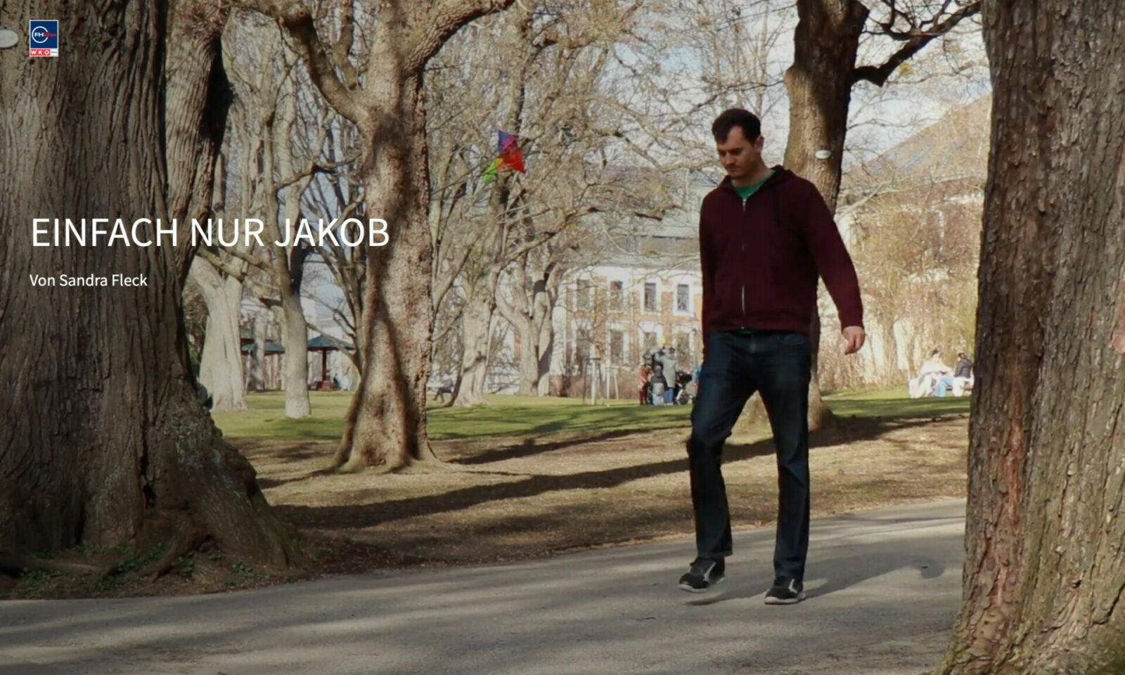 young man walking in park